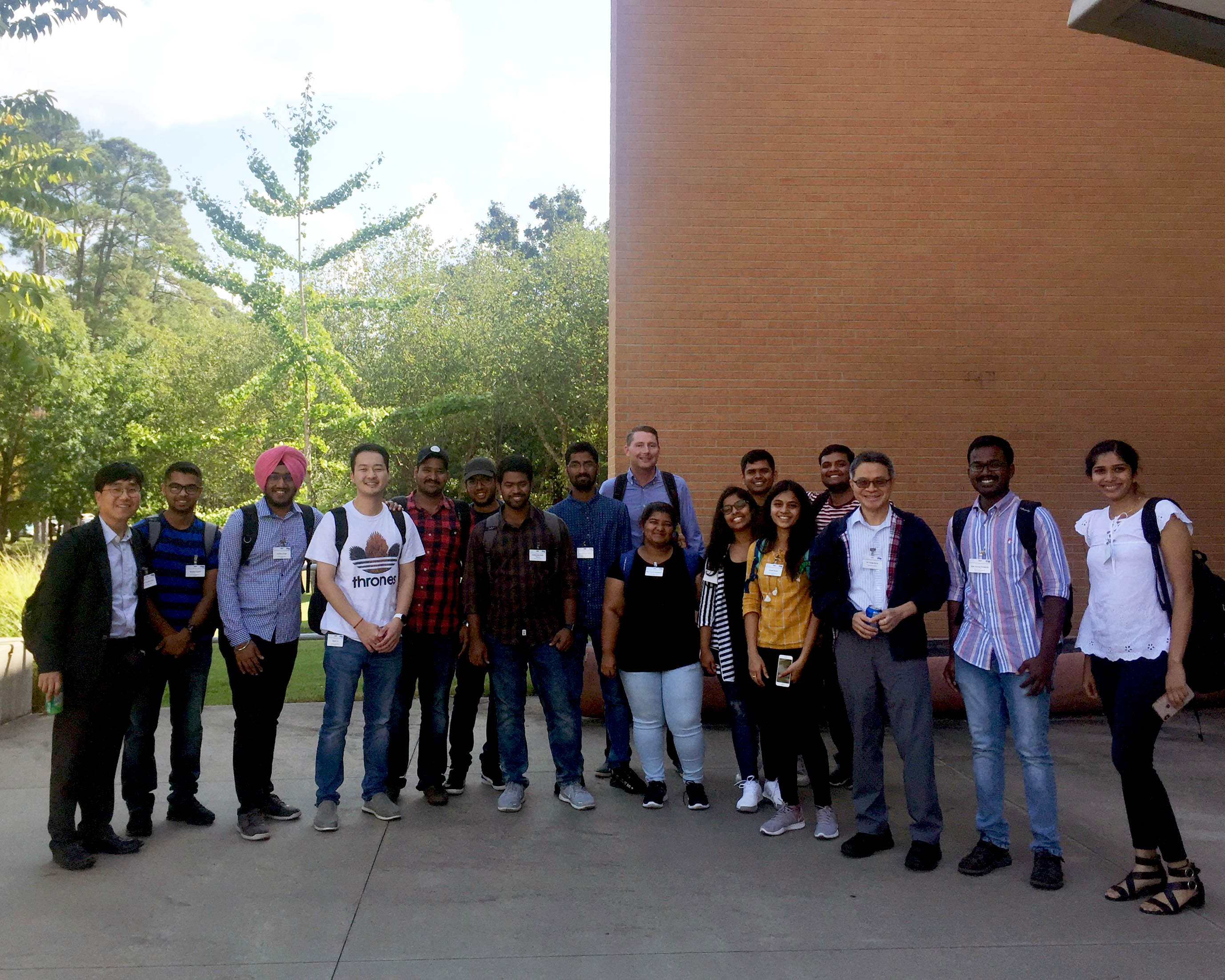A group of computer science students and 3 faculty members standing outside for a group picture where they attended a Data Science Workshop in Little Rock, AR.